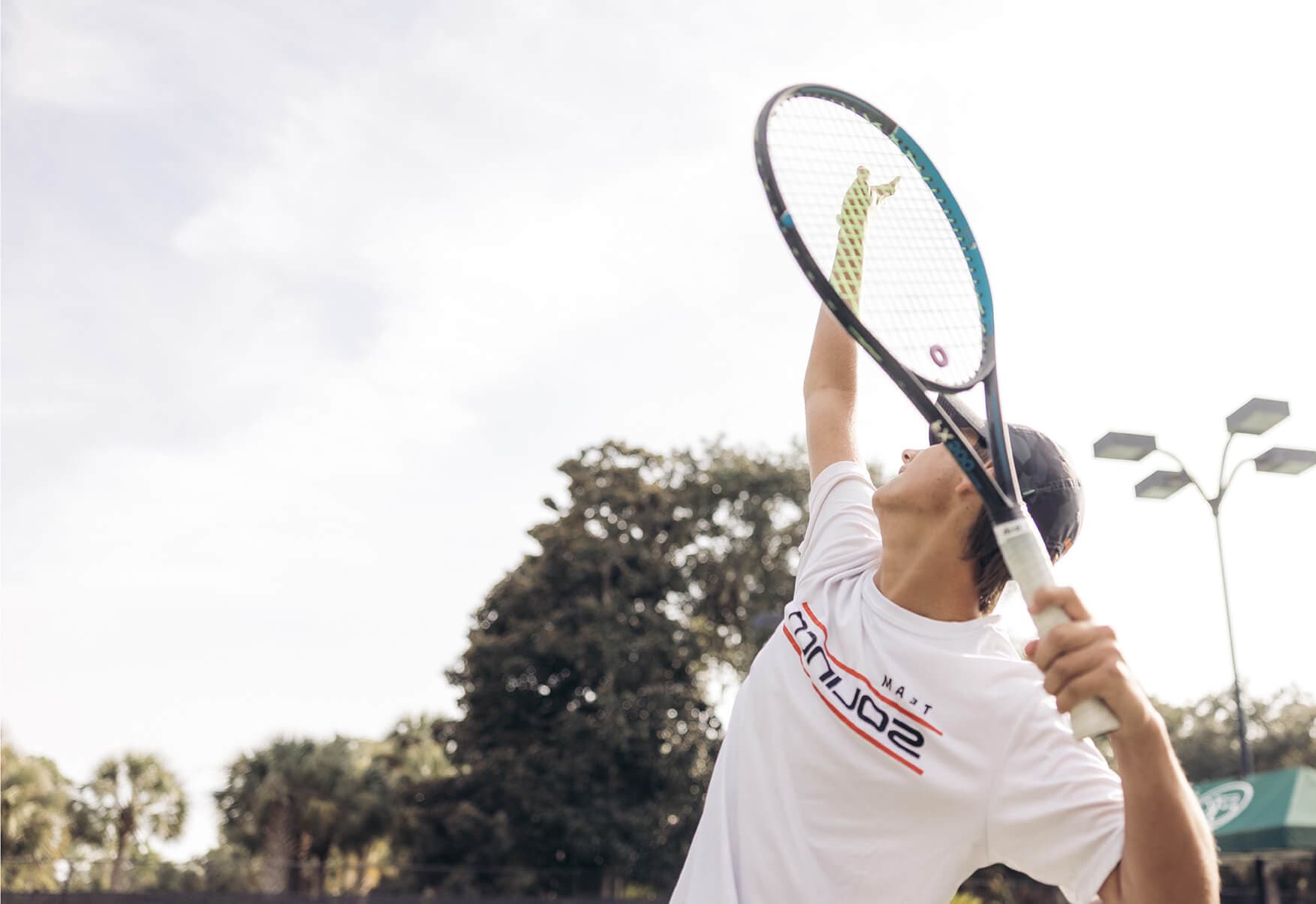 Tennis Player about to serve
